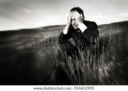 Lonely businessman depressed about life Stress Concept