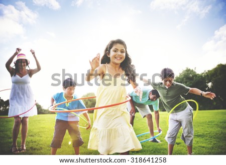 Family Hula Hooping Relaxing Outdoors Concept