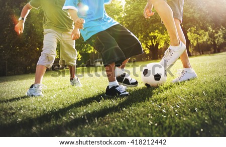 Little Boy Playing Soccer With His Father Concept