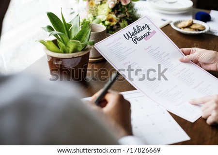 Hands Holding Wedding Planner Checklist Information Preparation