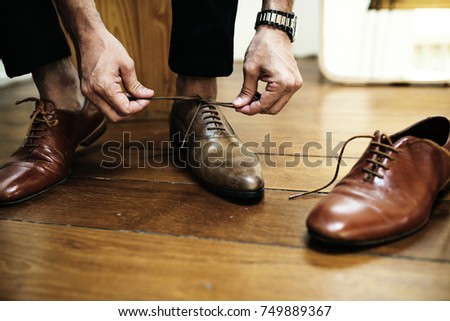 Man tying up his shoes