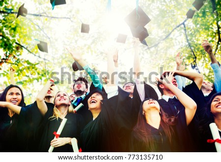 Graduating students throwing hats in the air