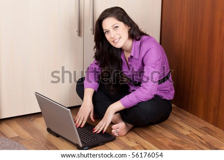 young lady on the floor with laptop