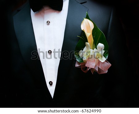 Grooms dress with flowers on chest