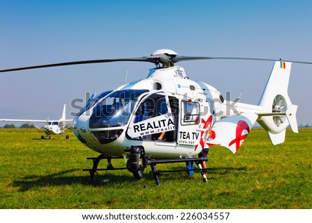 Brasov, Romania - August 12, 2010: TV news helicopter on a green field