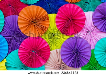 Colored paper, folded in a circle Ornamental decorated background.