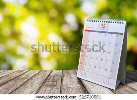 December Calendar  2016  on wood table with Beautiful Nature Bokeh.Blurred background