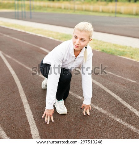 Athletic woman jogging in the evening. Training outdoors in sportswear. Concern about the health and figure.
