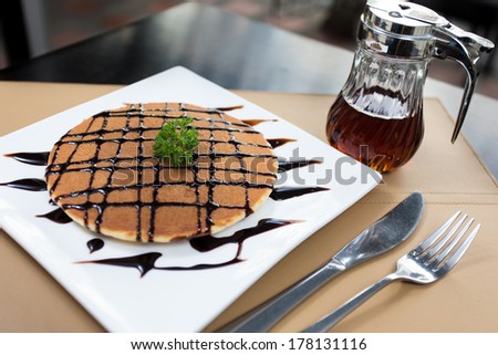 Sweet pancake with honey syrup and Chocolate sauce.Soft pancake eating with honey sauce it very delicious.