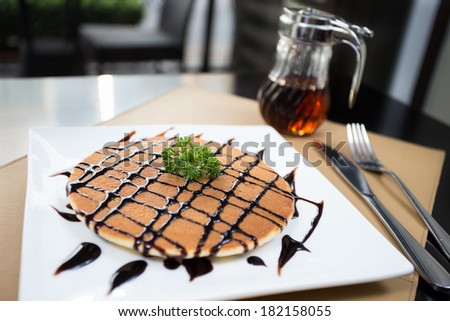 Sweet pancake with honey syrup and Chocolate sauce.Soft pancake eating with honey sauce it very delicious.