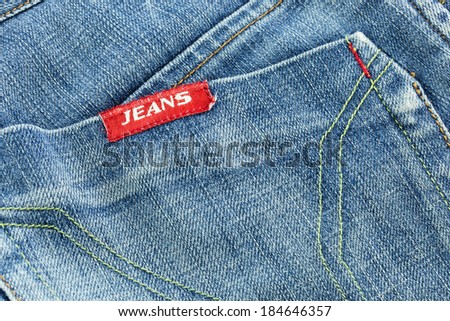 Close-up blue jean with pocket and blank leather label isolated on white background