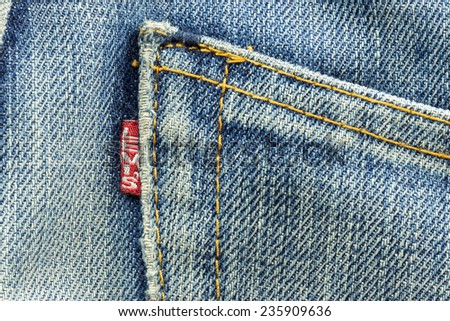 BANGKOK, THAILAND - March 24, 2014: Closeup of Levi\'s pocket and tag label of logo sewed on a blue jeans. Levi Strauss & Co is a privately held American clothing company.