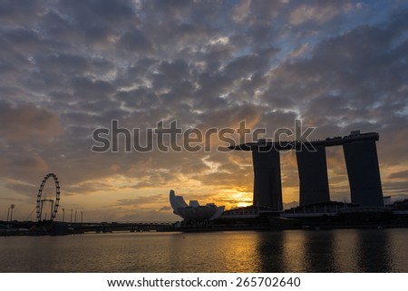 SINGAPORE-JAN 31, 2015: Silhouette of Marina Bay Sands hotel and view of Marina Bay in Singapore with amazing cloud in morning.