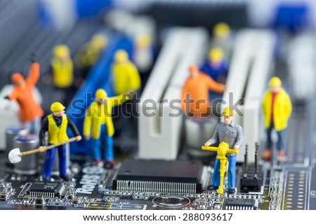 Team of engineers repairing circuit mother board. Computer repair concept