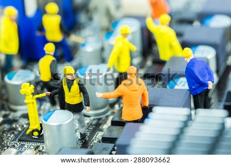 Team of engineers repairing circuit mother board. Computer repair concept