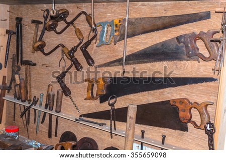 Old woodworking tools in a carpenter\'s workshop.