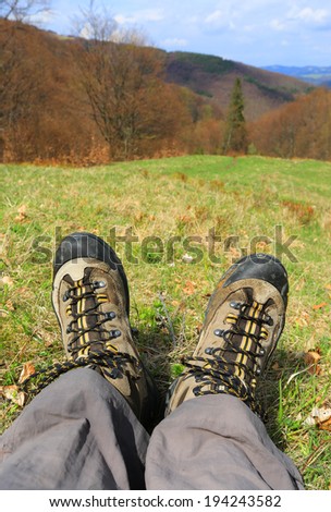 Hiking Feet on meadow in mountains