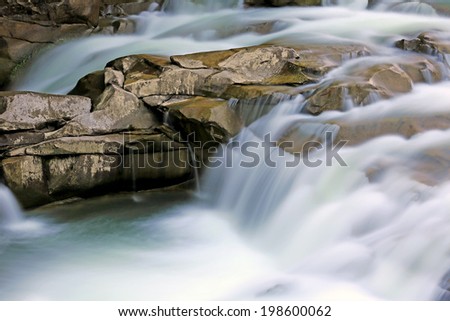 run of mountain stream among stones