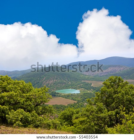 mountain landscape with lake in away