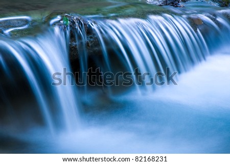 Blue cascade of mountain river