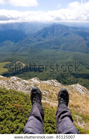 Hiking Feet over valley in mountains