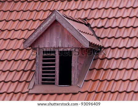 squint window on red roof