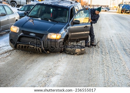 November 24,2014, Coronet Road, Edmonton, Alberta, Canada. A frustrated driver is wondering what has happened with his car on his next day follow up visit to repair shop.