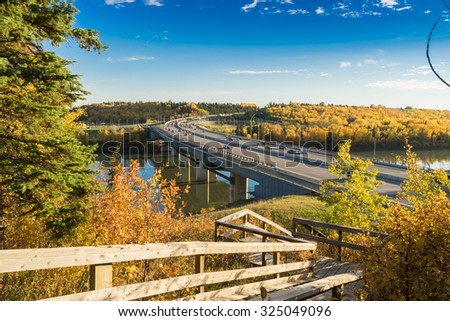 view to Quesnell Bridge in Edmonton from wooden steps at north side of the North Saskatchewan river