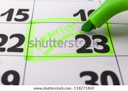 Calendar with dentist appointment highlighted with green marker