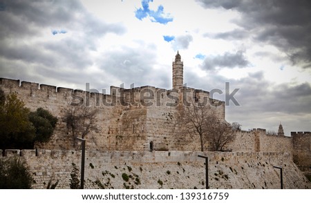David tower in jerusalem stone boundary wall with cloudy sky