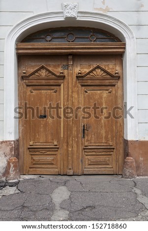 Ancient wooden double sided entrance gate building exterior