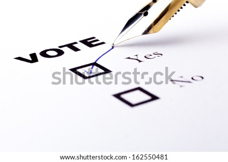 Voting yes or no check-box with fountain pen yes marked with V