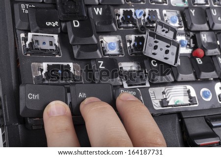 Fingers on alt ctrl delete keys on broken laptop keyboard