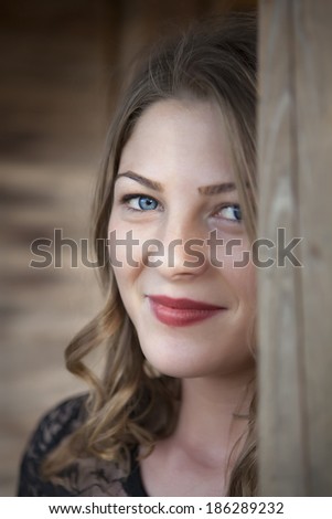 Young woman with blue eyes smiling close-up