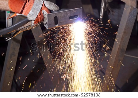 sparks made while plasma cutting  steel plate