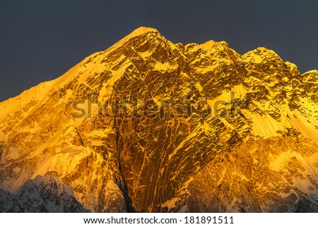 mountains clothed in the evening glow
