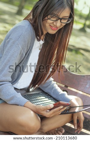 happy girl with technology technology and internet concept