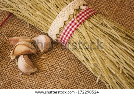 Fresh italian pasta uncooked, tied with red and white band and rustic band, on wooden table.
