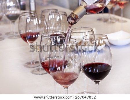 Wine tasting: rose wine being poured into a glass