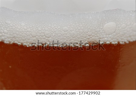 Beer bubbles of a fresh beer cup