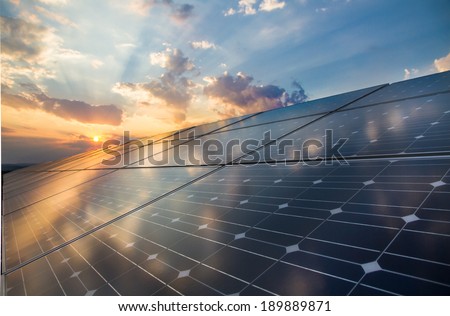 Photovoltaic cells on the background of a sunset