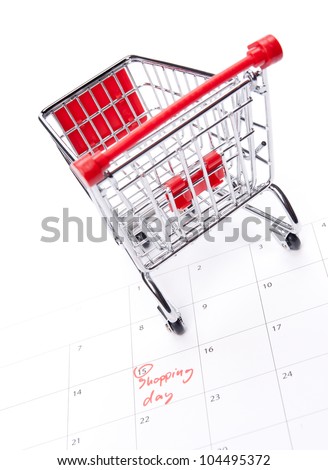 Shopping day reminder in calendar and shopping cart model - shopaholic concept. Look forward to shopping.