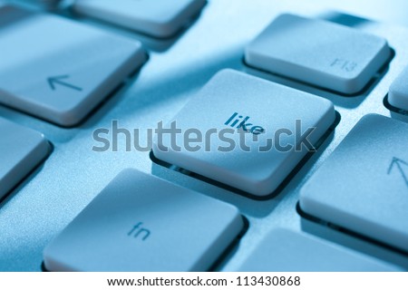 Like button on computer keyboard - social network concept.