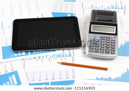 Concept of business report analysis - digital tablet, graph, sheet, calculator and pencil. You may place your own screen, for example web page on tablet screen.