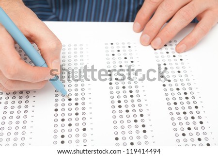 Student complete the questionnaire (filling the test form) - school exam concept and another test completing (new job interview, IQ test etc.).