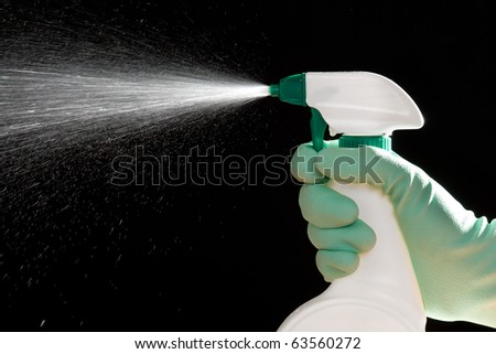stock photo : Sanitation worker spray cleaning agent