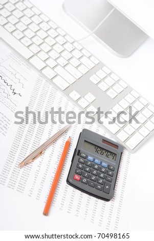 Business analyst workplace - pencil, pen, sheet with numbers, graph, keyboard, part of computer and calculator