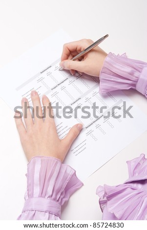 Woman filling the form on job interview. Top view.