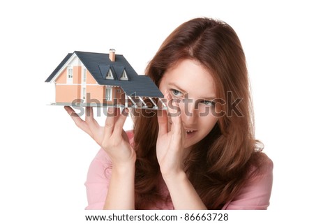 Woman (estate agency client or architect) browse new house represented by model