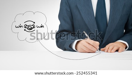 Win-win partnership strategy concept. Businessman sign positive win-win strategy agreement (contract).